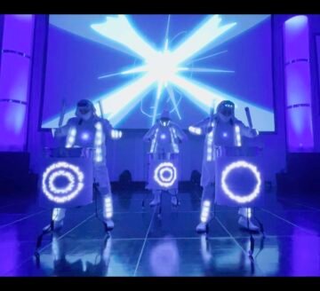 Dance crew LED performance. LED light-up dance crew with futuristic costumes at Mixd Elements event.