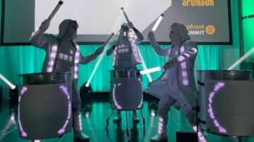 Innovative dance performance by Mixd Elements Dance Crew at a corporate event. High-tech robotic dancers performing with LED light sticks at a live event.