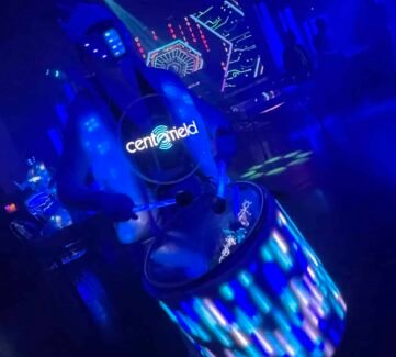 Vibrant dance crew performance at Centerville nightclub with colorful LED lighting and energetic atmosphere. LED-lit dance crew at Centerville nightclub with dynamic lighting and vibrant stage presence.